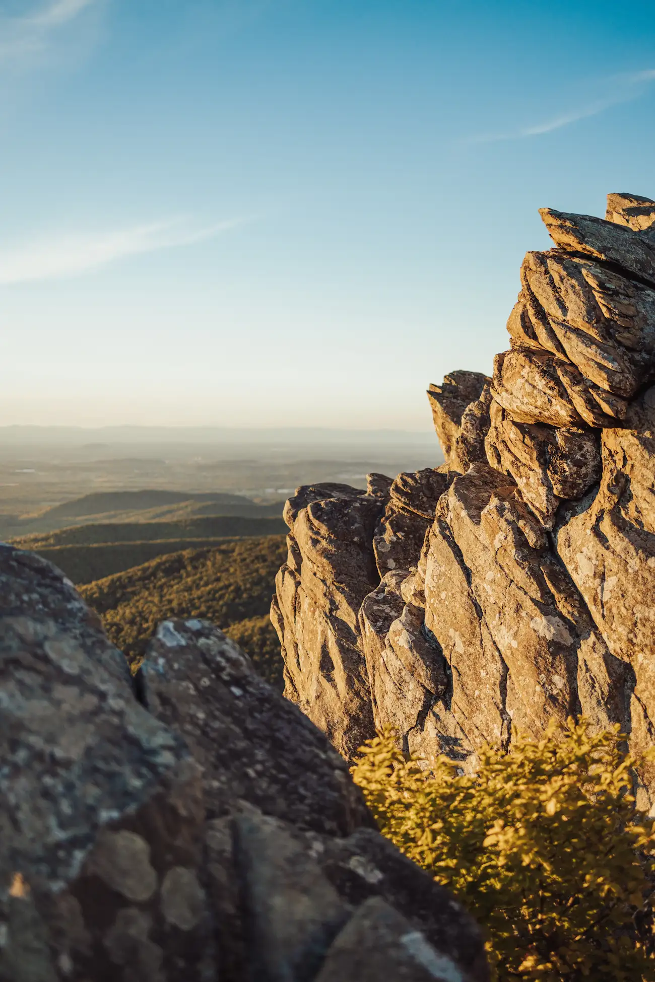Sunlit rock outcrop above a Blue Ridge valley