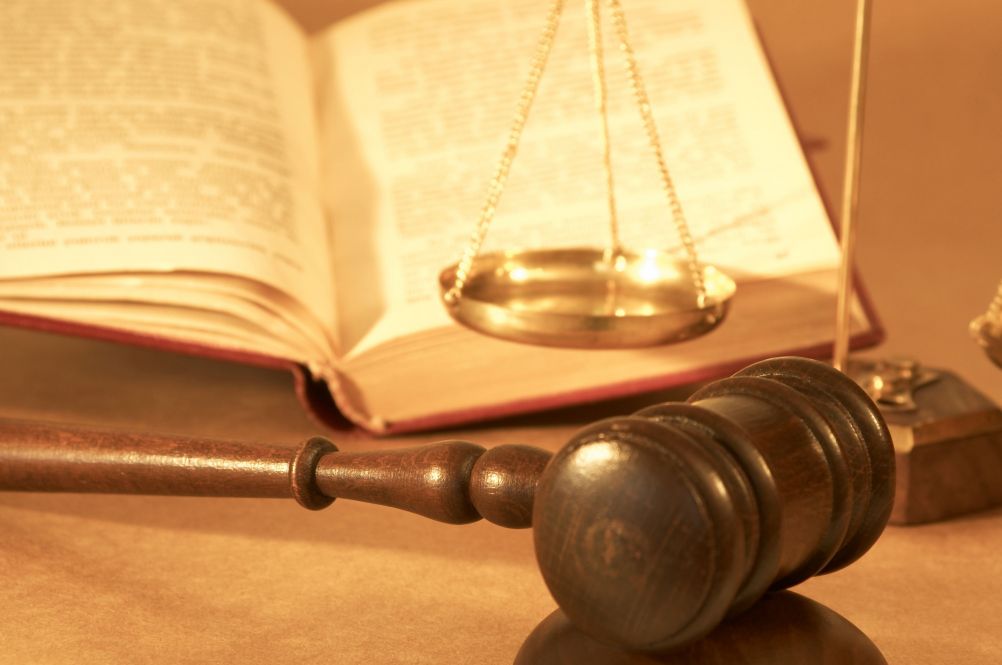 Gavel, scales of justice, and an open law book